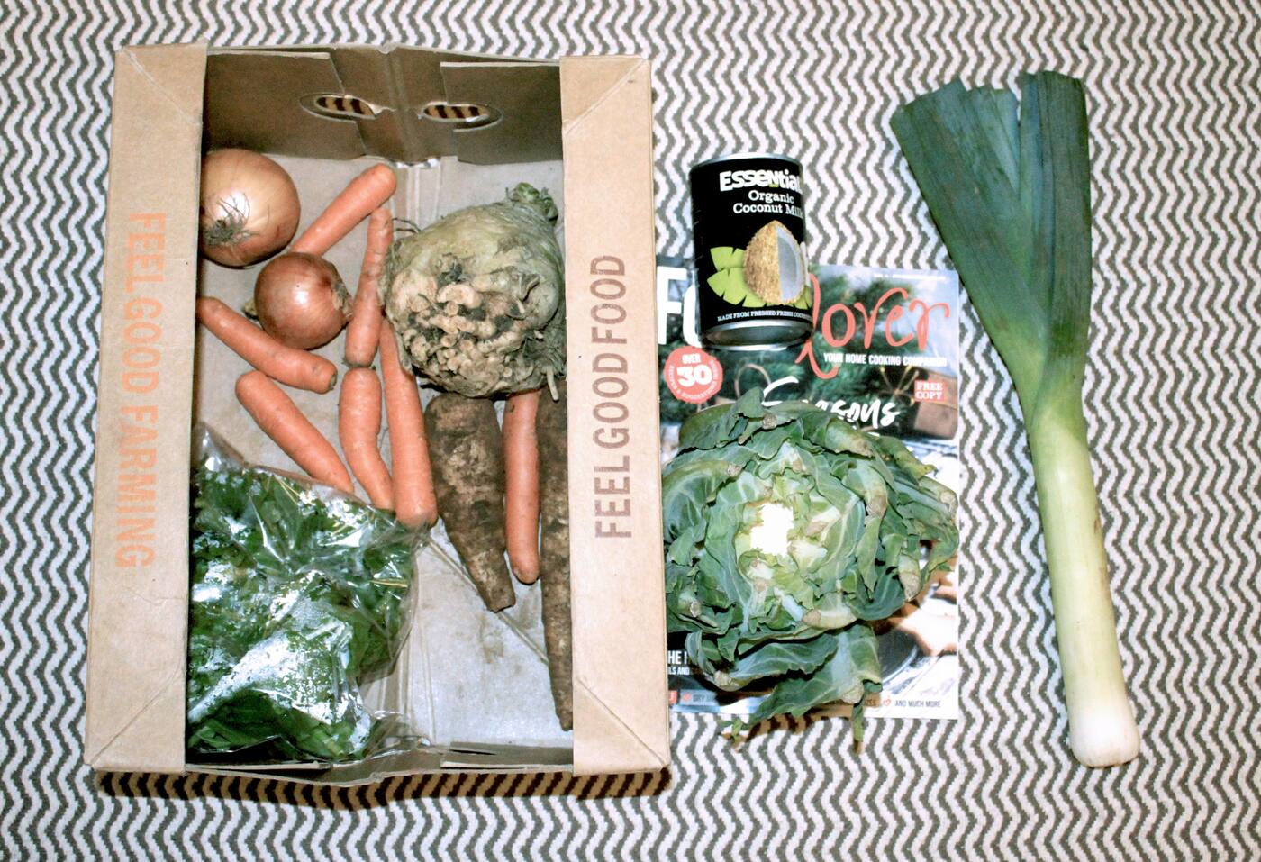 Box of fresh whole-food vegetables labelled Feel Good Food